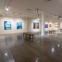 Installation shot from ONE PLACE. TWO VIEWS. John Walker and Kayla Mohammadi at the Maier Museum