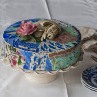 N>D> glass, ceramic with Capodimonte rose, corals, Nautilus shell and hand carved antler lobster figurine on crystal glass pedestal. 12 inch diameter, 4 inches tall, 9 inches with cake stand