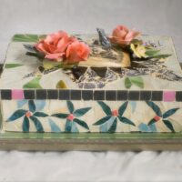 glass, ceramic and tile with etched Scrimshaw, Wadde figurines, Capodimonte Roses, vintage Staffrodshire flowers on a marble slab. 13 x 9 1/2 inches