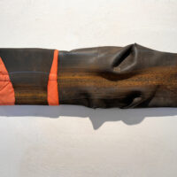 2016. fabric, inner tube on wood 8 x 22 x 2 1/2 inches