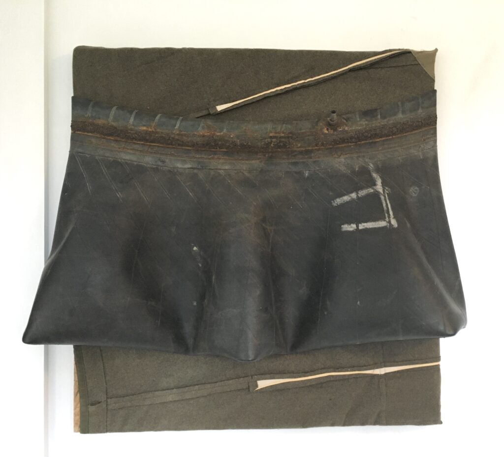 2024 found truck tire inner tube and wool pants on board 28 x 32 x 5 inches